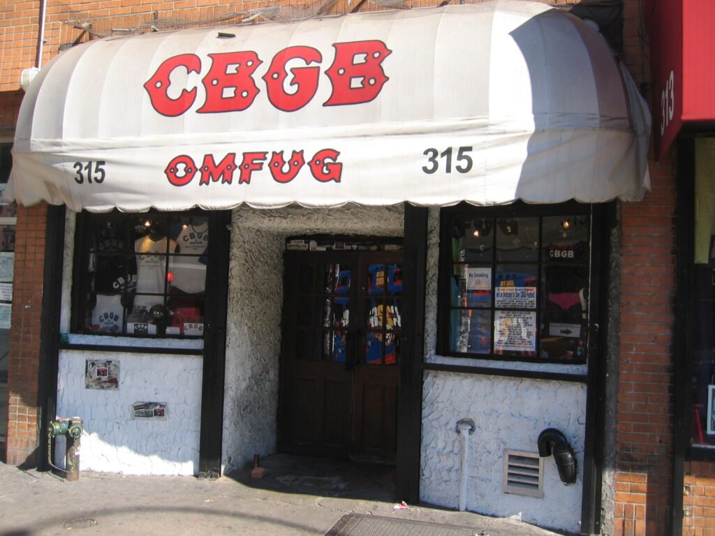 The CBGB club facade on the Bowery in New York, the punk world Elena Altieri photographed — for readers asking is Hear the Dead worth reading
