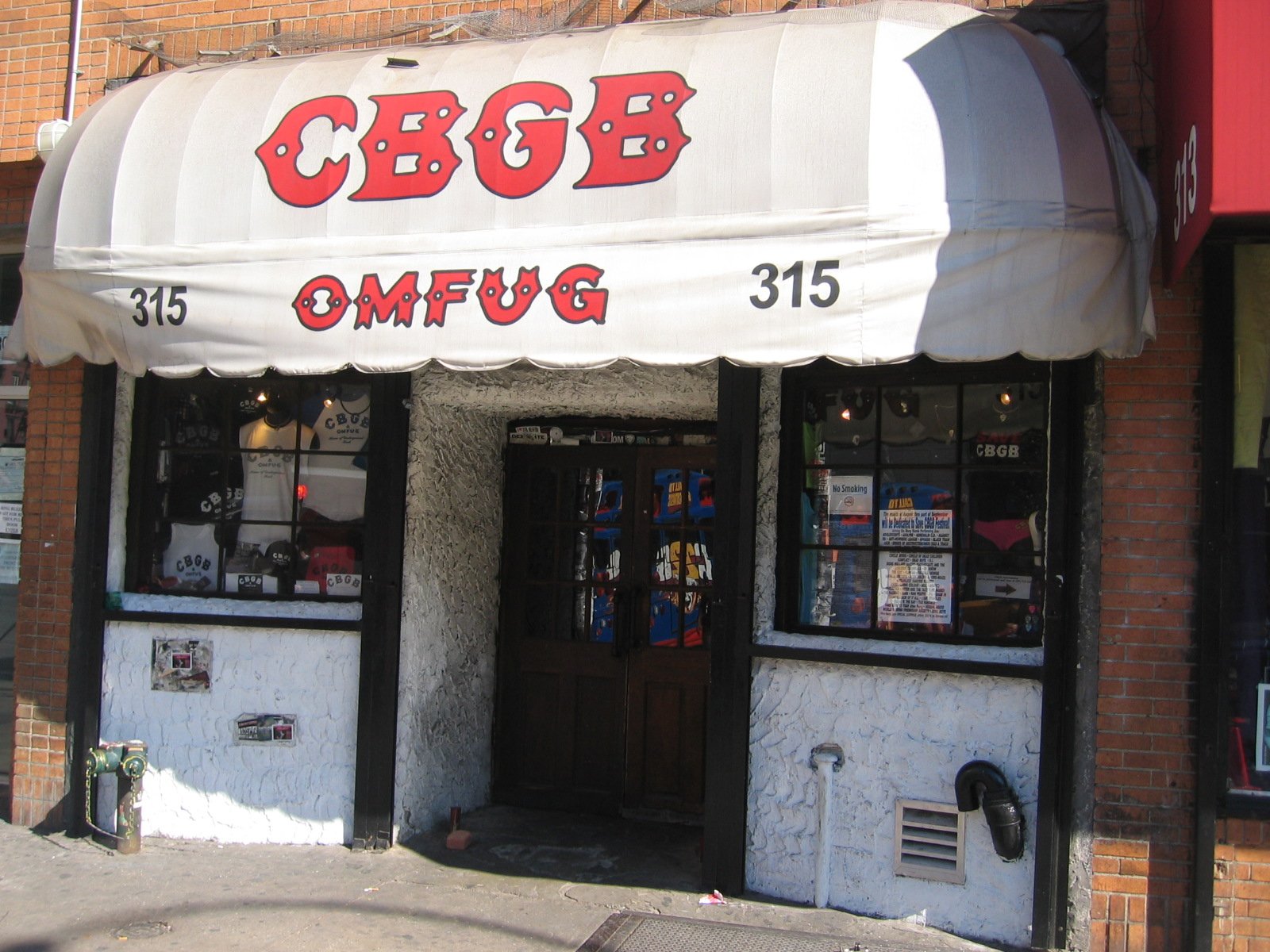 The CBGB club facade on the Bowery in New York, the punk world Elena Altieri photographed — for readers asking is Hear the Dead worth reading