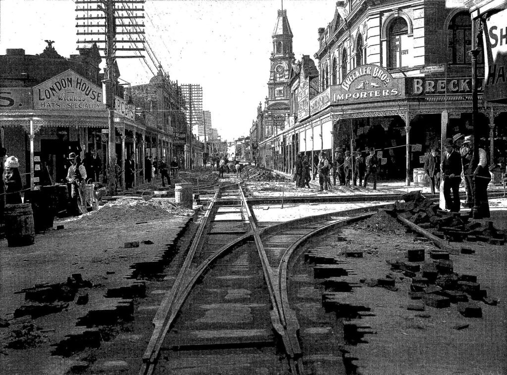 Tram tracks being laid in Fremantle in 1905, a nod to the trolley problem at the heart of the contractarian view of morality
