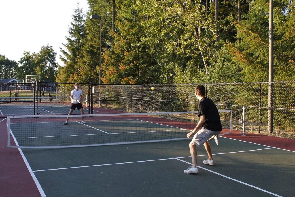 Pickleball players on an outdoor court