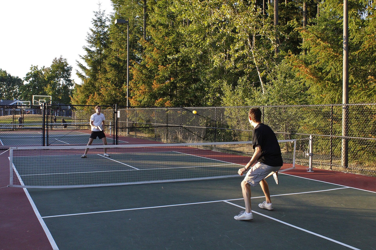 Pickleball players on an outdoor court