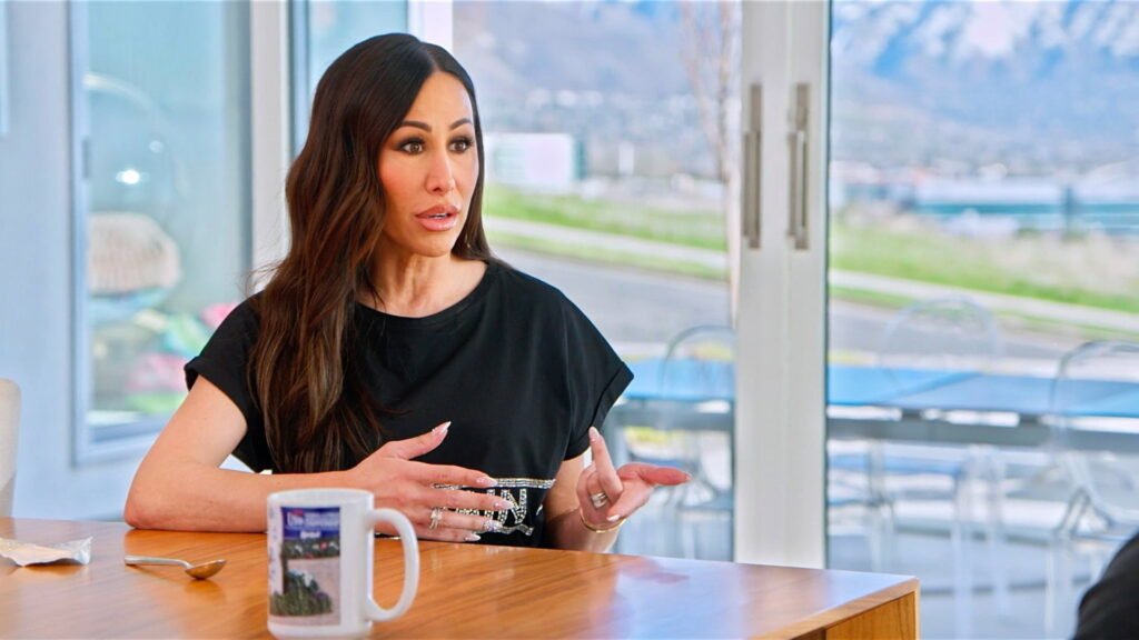 Angie Katsanevas talking at a table