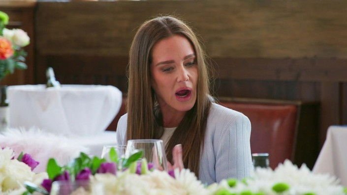 Meredith Marks speaking at the lunch table