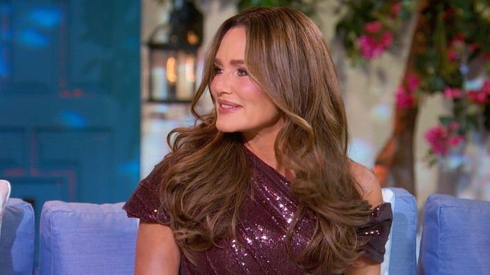 Meredith Marks on the reunion couch in a burgundy sequined gown