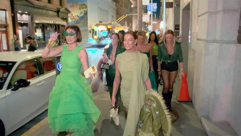 The women walking together on a night out in San Francisco, dressed in green