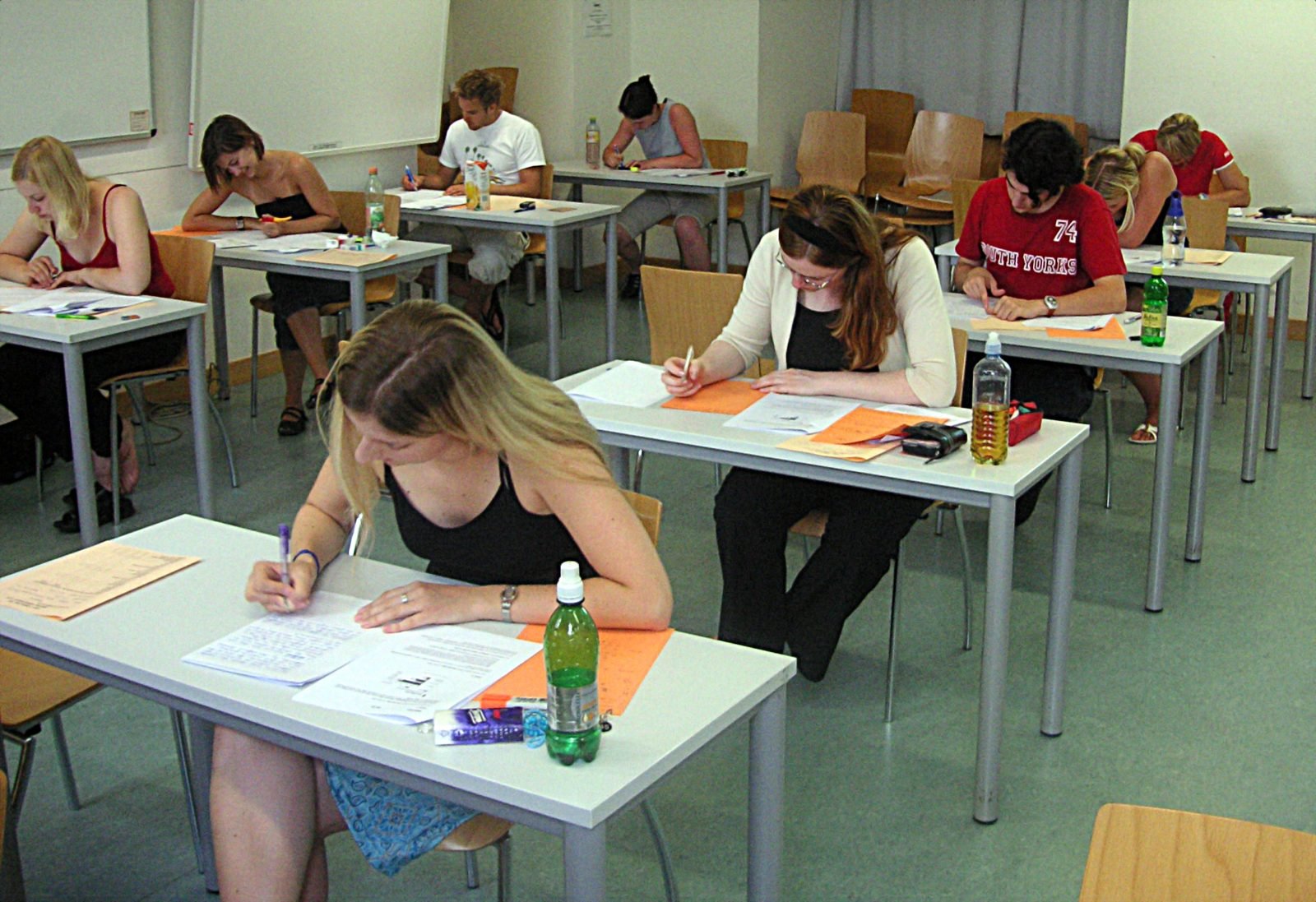 Students sitting an examination, illustrating the debate over shorter SAT reading passages